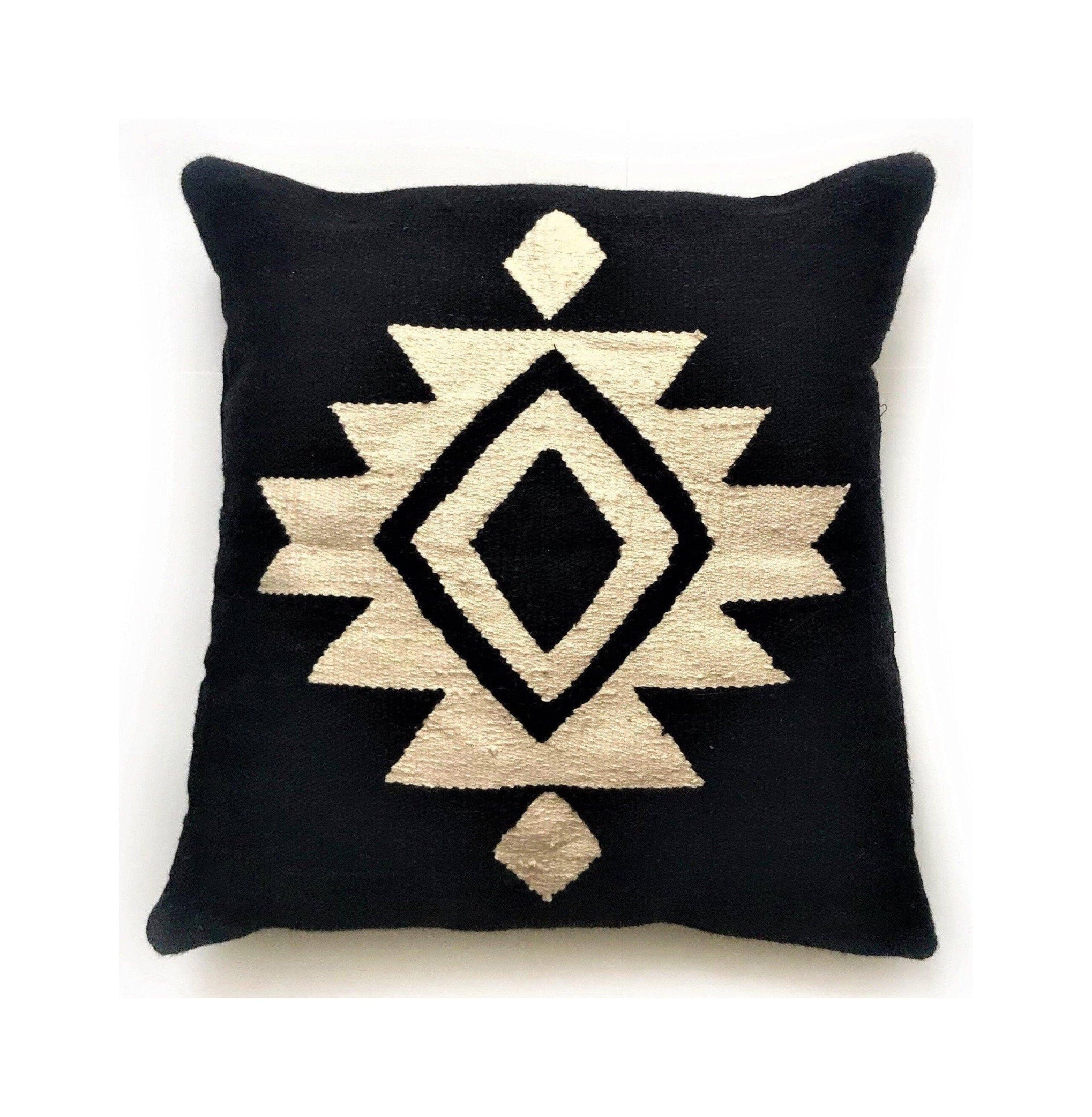 Black pillow with a geometric pattern on a white background
