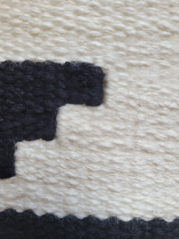 black and cream decorative pillow