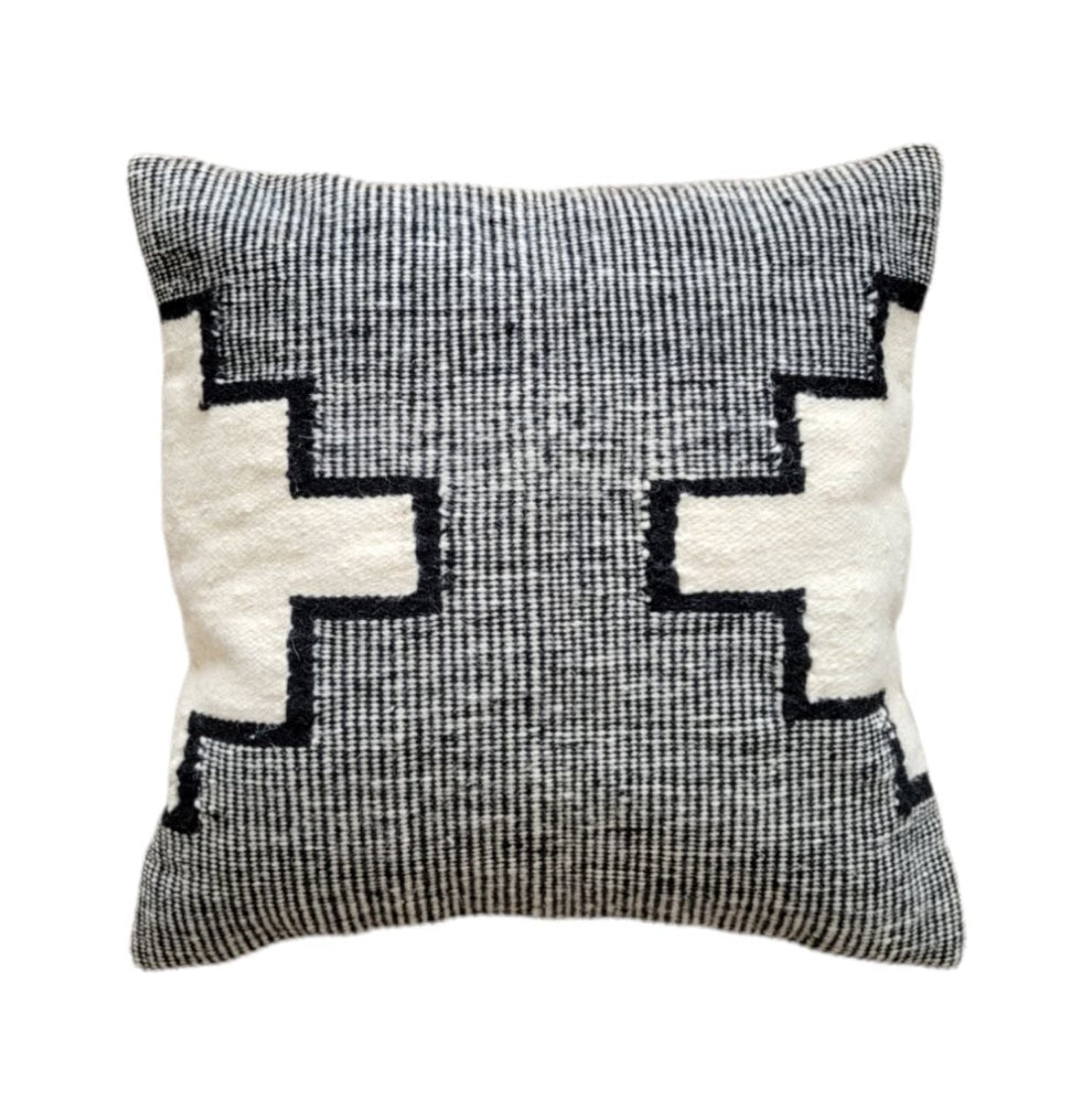 Decorative pillow with geometric pattern on a white background