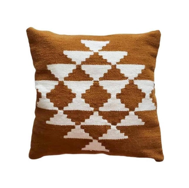 Brown pillow with geometric pattern