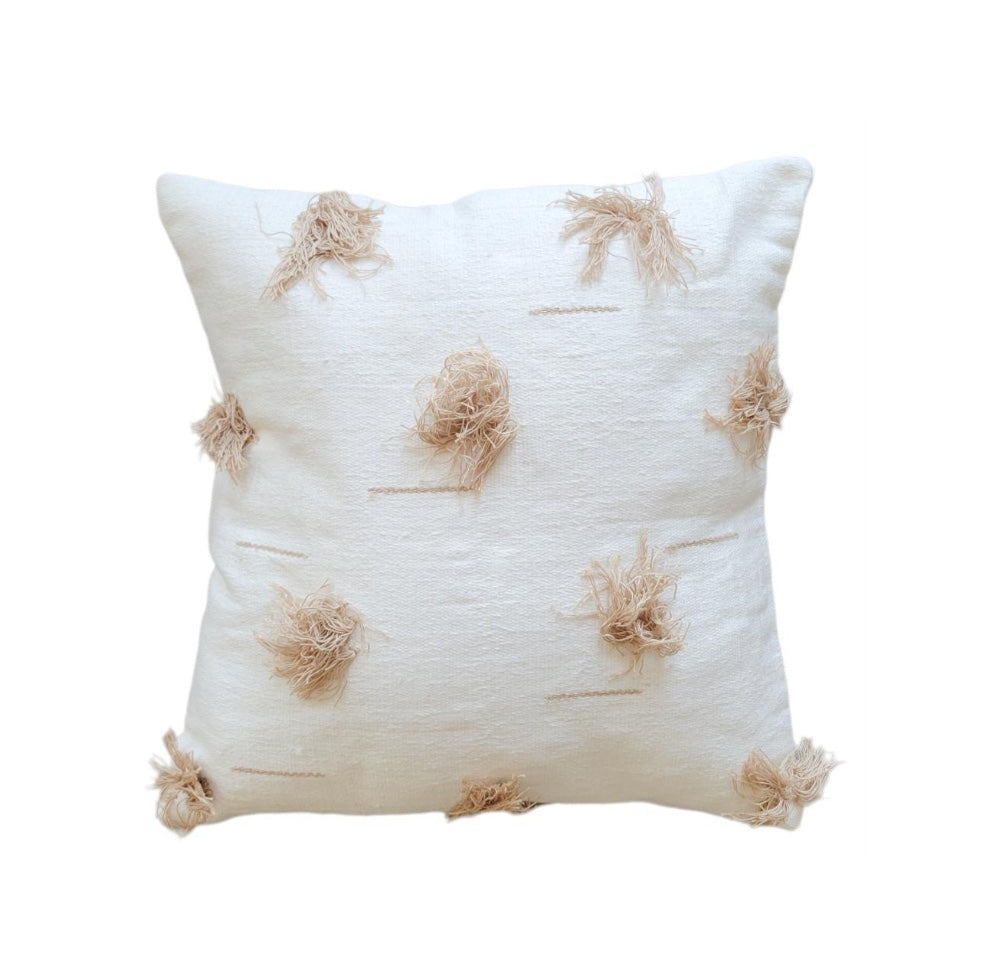 Decorative pillow with tassel patterns on a white background