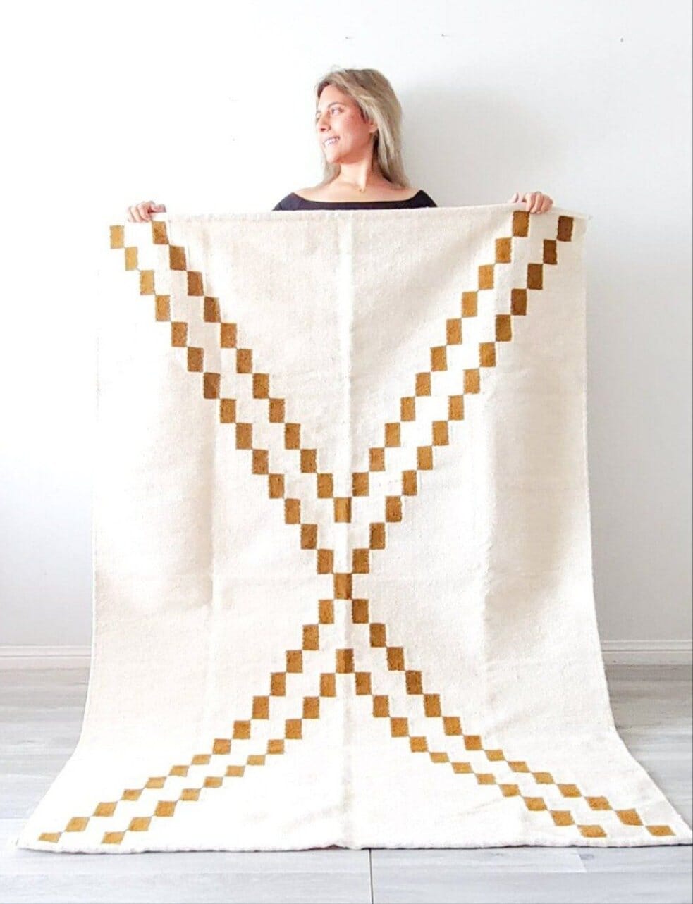 gold and cream woven rug
