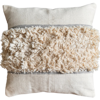 Decorative pillow with textured beige top and plain bottom on a white background