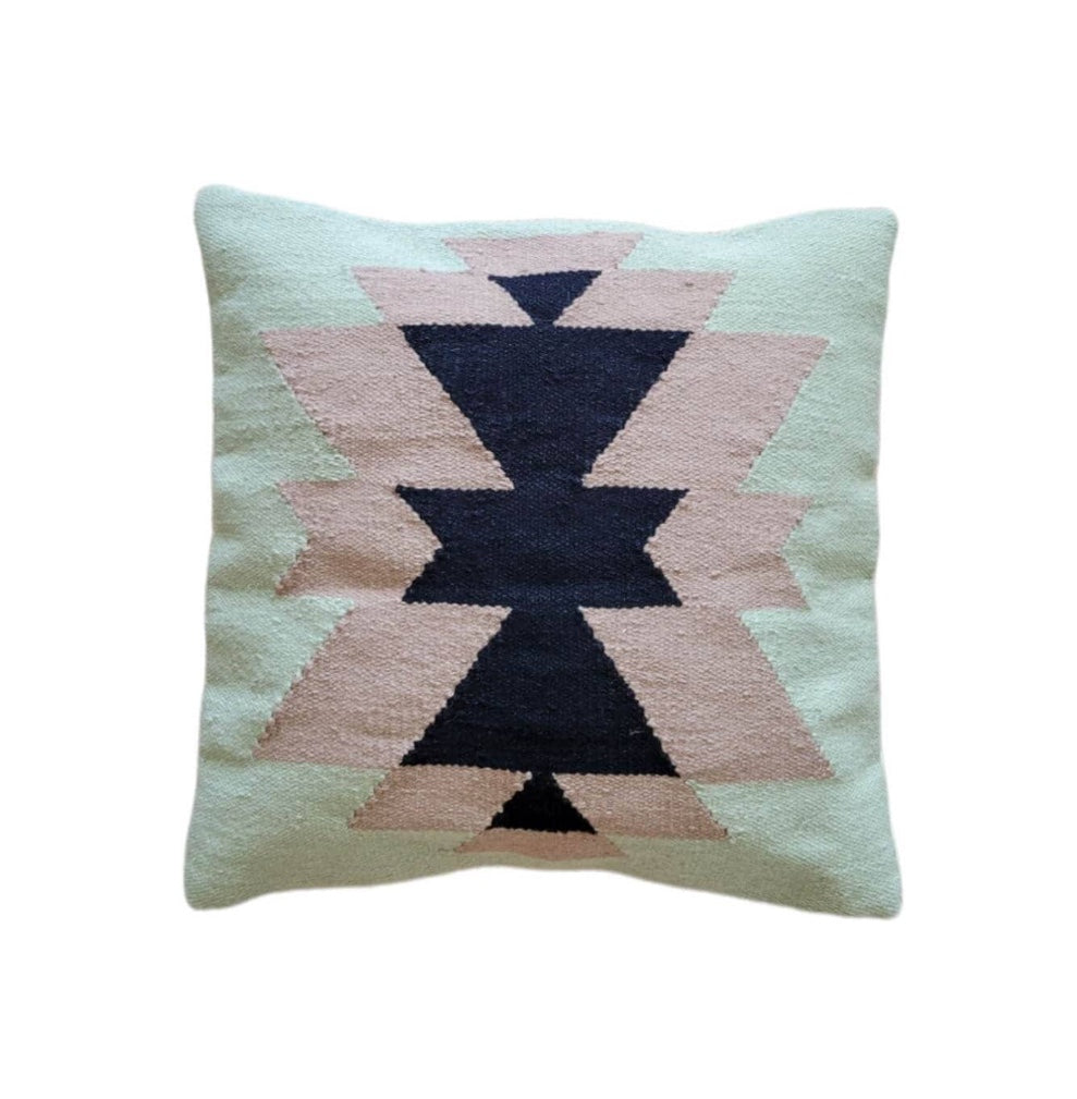 Decorative pillow with geometric pattern on a light background