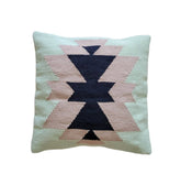 Decorative pillow with geometric pattern on a light background