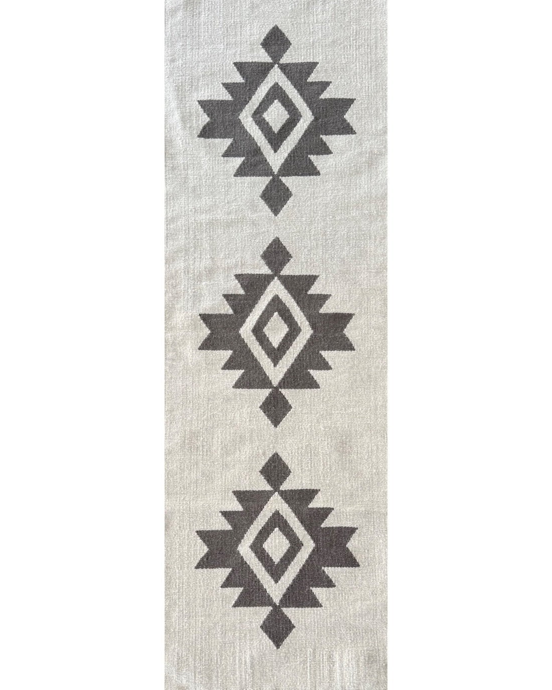 Rug with black geometric pattern on a light gray background