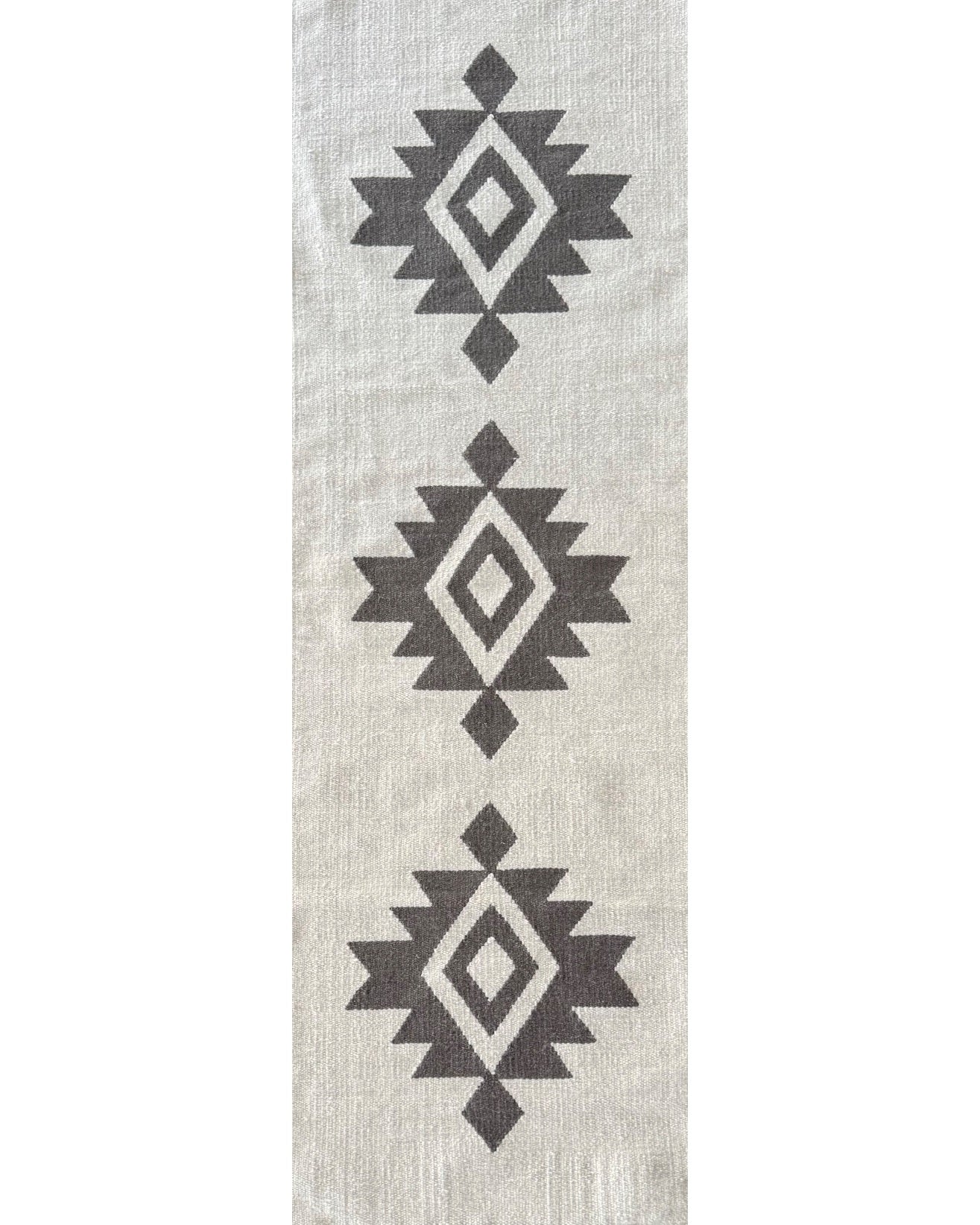 Rug with black geometric pattern on a light gray background