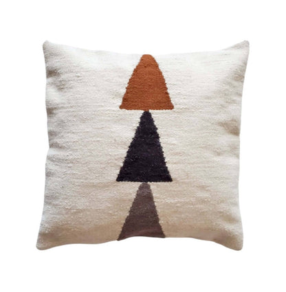 Decorative pillow with geometric triangle pattern on a cream background