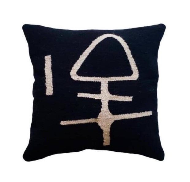 Black pillow with white abstract design