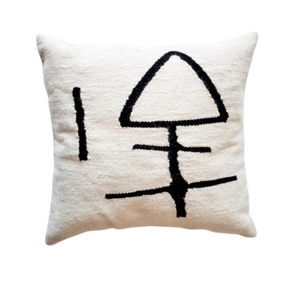 Decorative pillow with abstract black design on a white background