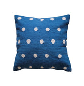 Blue pillow with white polka dots