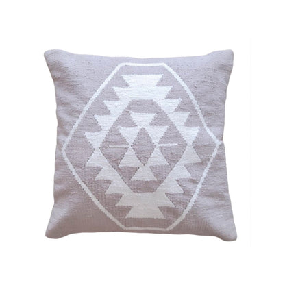 Taupe pillow with white geometric pattern on a white background