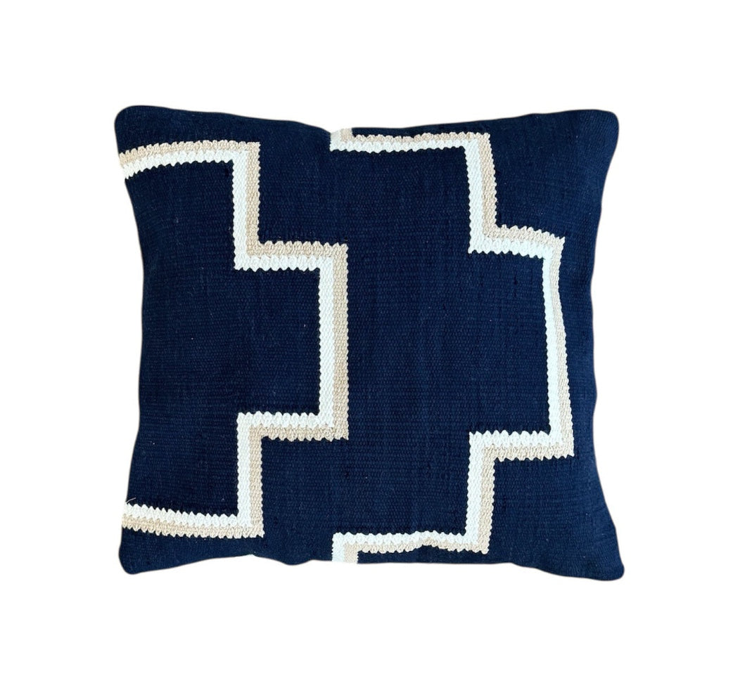 Ivory Beige pillow with white zigzag pattern on a Navy Blue background