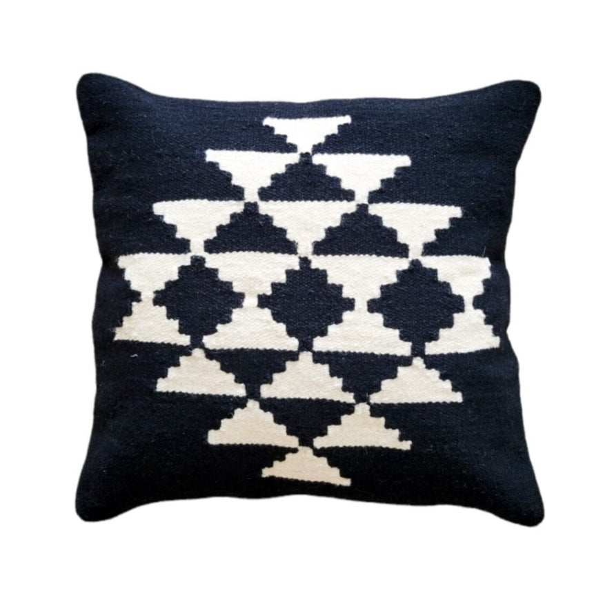 Black pillow with white geometric pattern