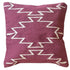 Decorative pillow with zigzag pattern on a white background