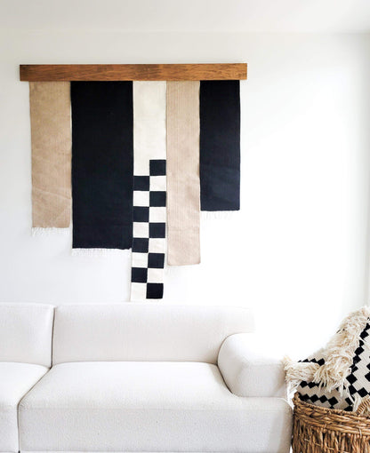 black and beige hanging rug