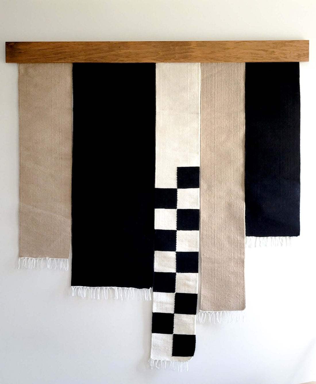 black and beige wall hanging rug