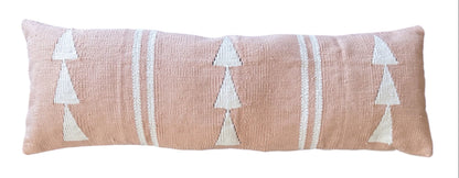Long rectangular pillow with geometric pink pattern on a white background