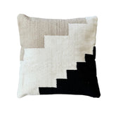 Decorative cotton pillow with a geometric pattern on a white background