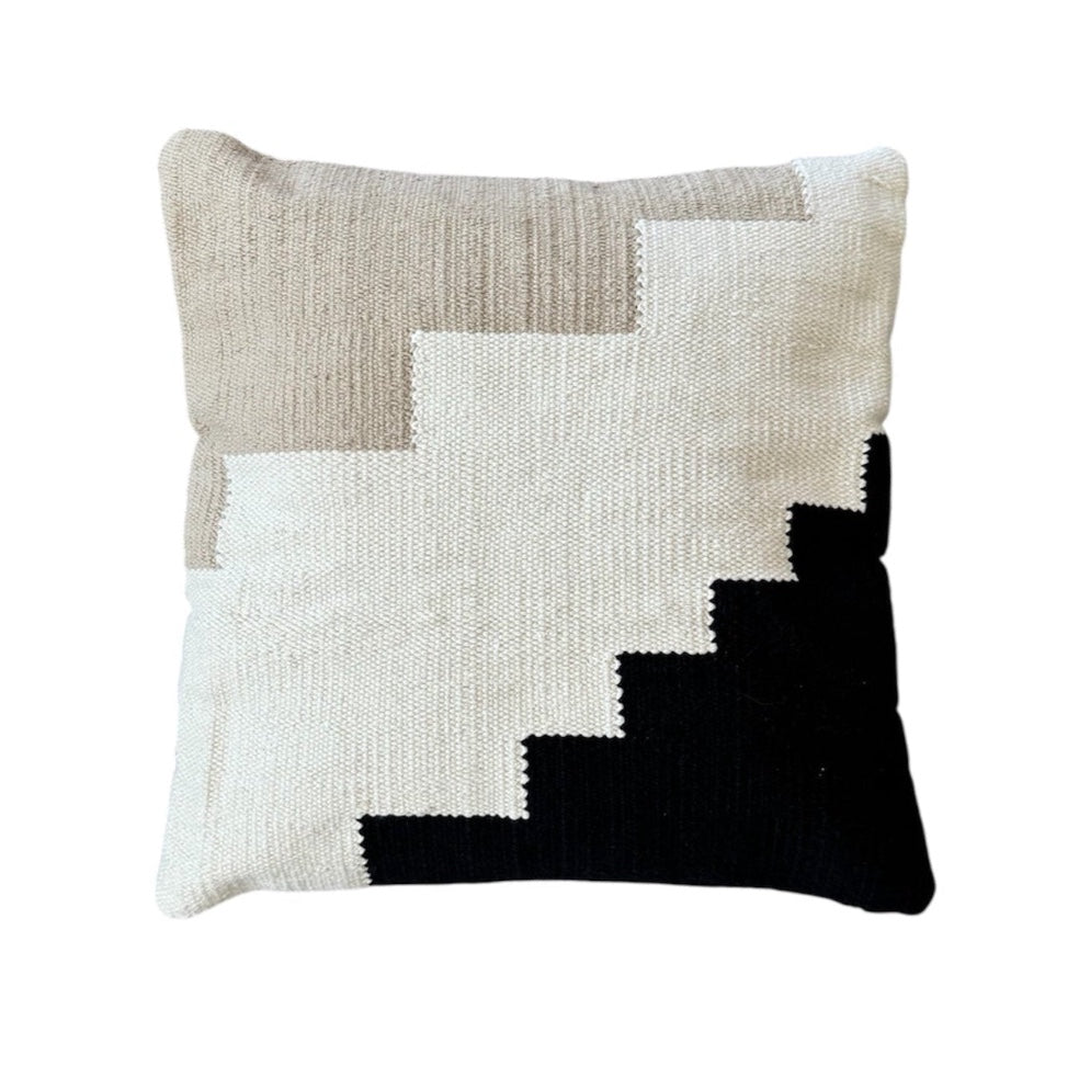 Decorative cotton pillow with a geometric pattern on a white background