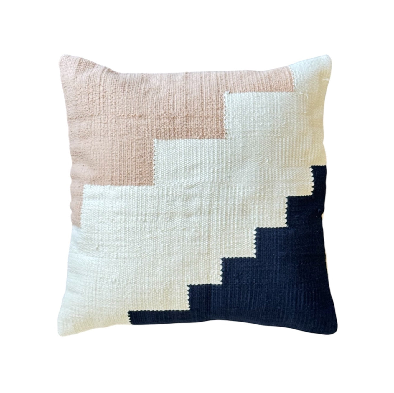 Decorative pillow with geometric pattern on a white background