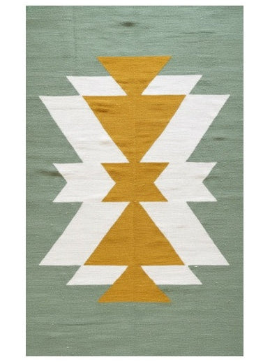 Rug with geometric pattern on a green background