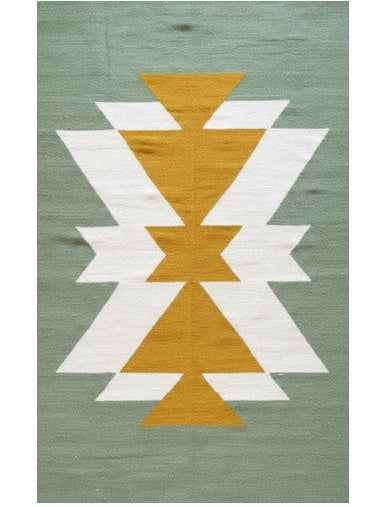 Rug with geometric pattern on a green background