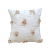 Decorative pillow with tassel patterns on a white background
