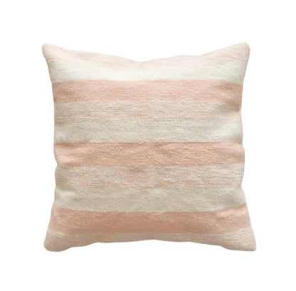 Striped pillow with pink and beige colors on a cream ivory background