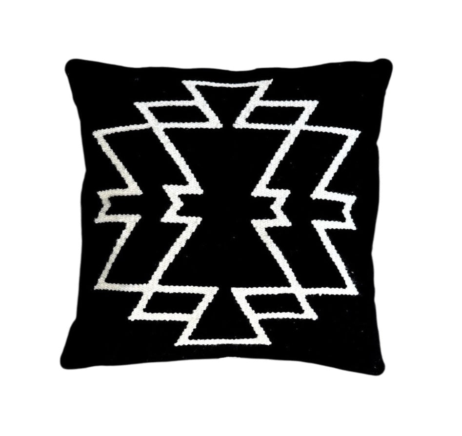 Black pillow with white geometric pattern