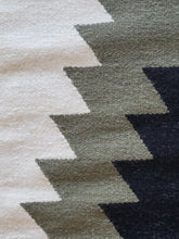 green and white wool kilim