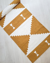 mustard and white handmade rug