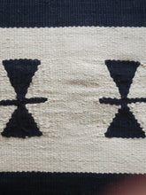 black handwoven pillow