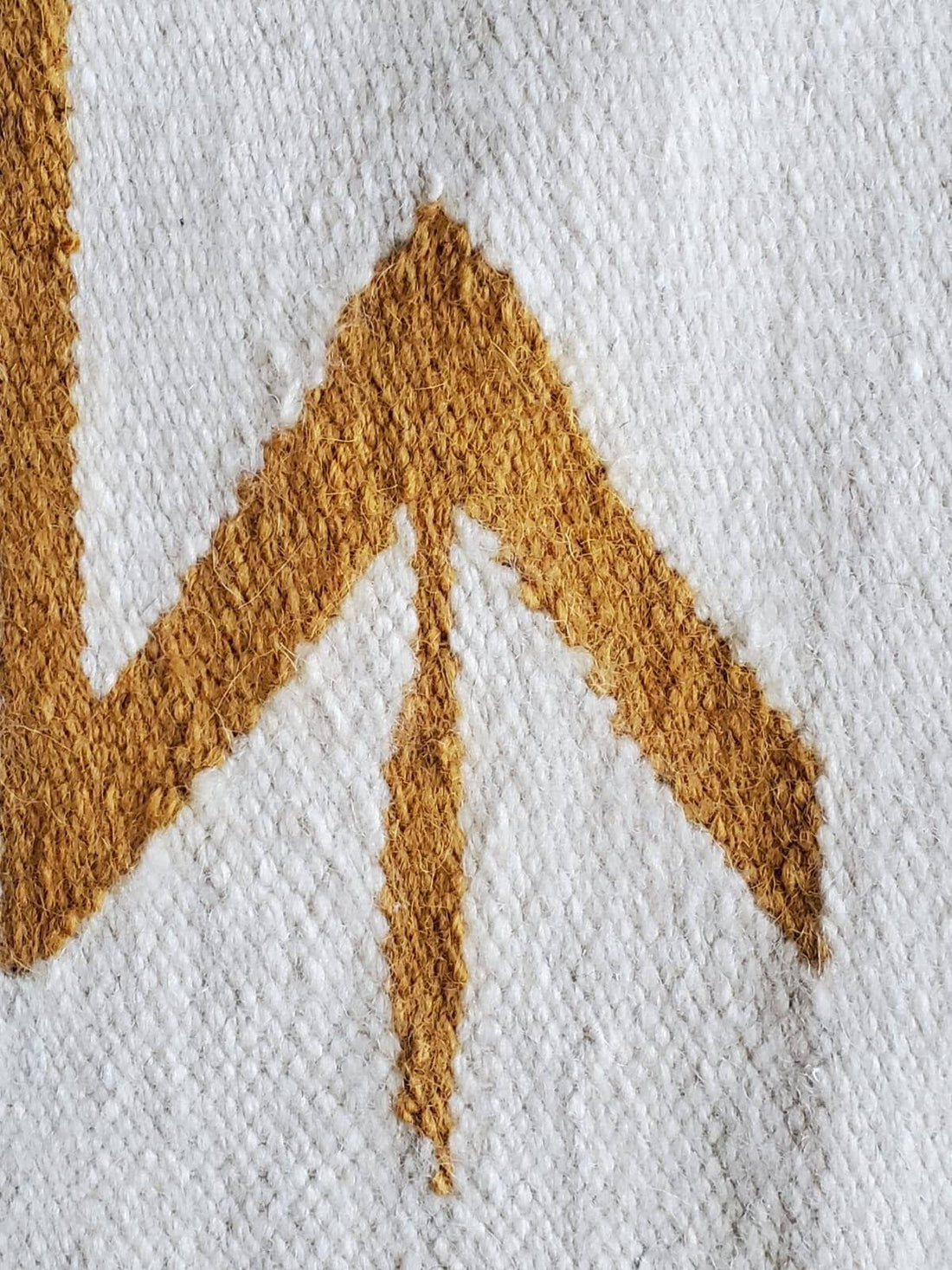 mustard and off white rug