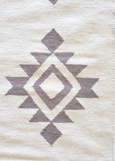 white rug wall hanging